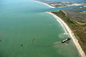 Photo of barge gathering sediment near the Canaveral Sand Bypass